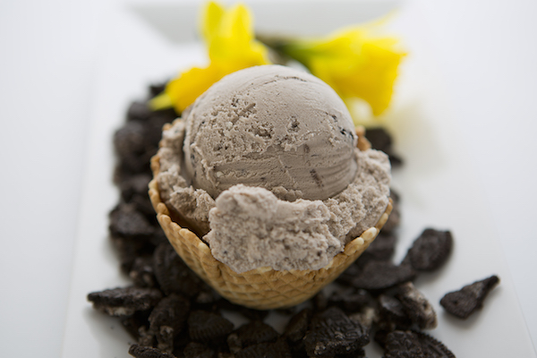 Guests enjoying catered ice cream bar at outdoor summer party in suburban Cook County, Guests enjoying catered ice cream cups at a summer birthday party in Hoffman Estates, Catering staff preparing customized ice cream servings with organized toppings and presentation, Mobile ice cream station serving sundaes at a busy outdoor party in Lombard, Catering staff serving ice cream efficiently with clean organized event presentation